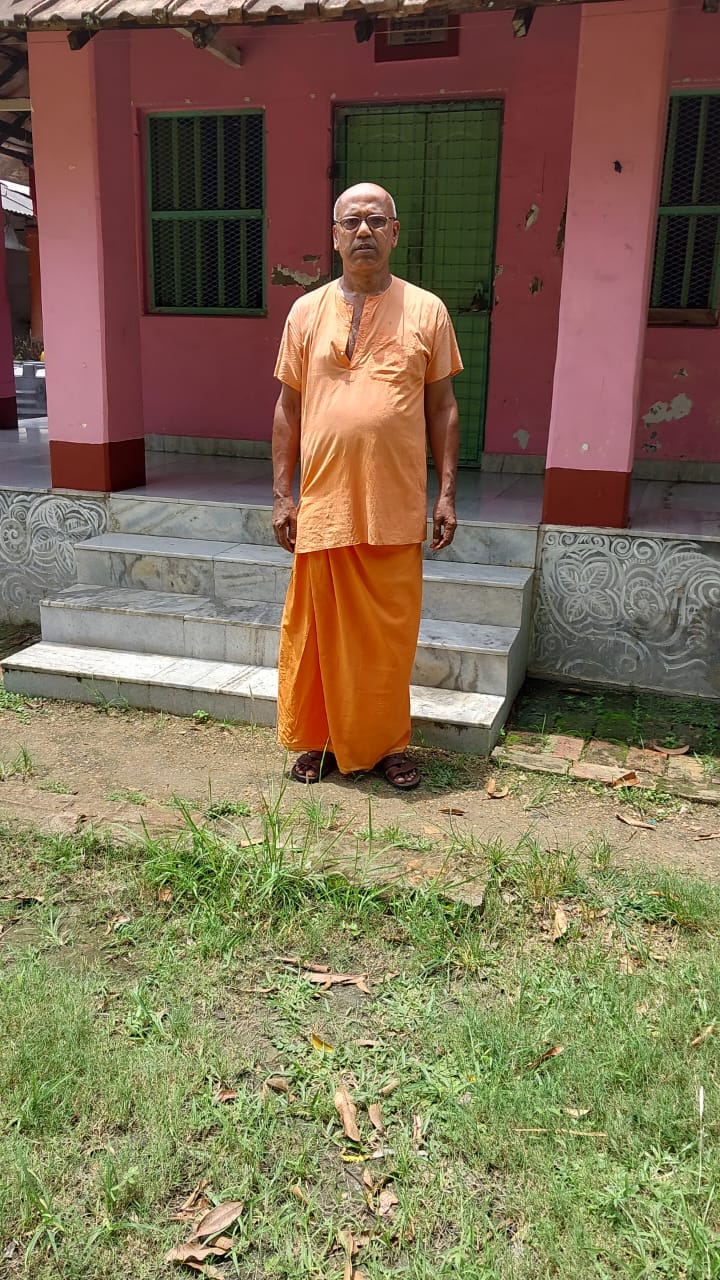 Ashram secretary during community activity