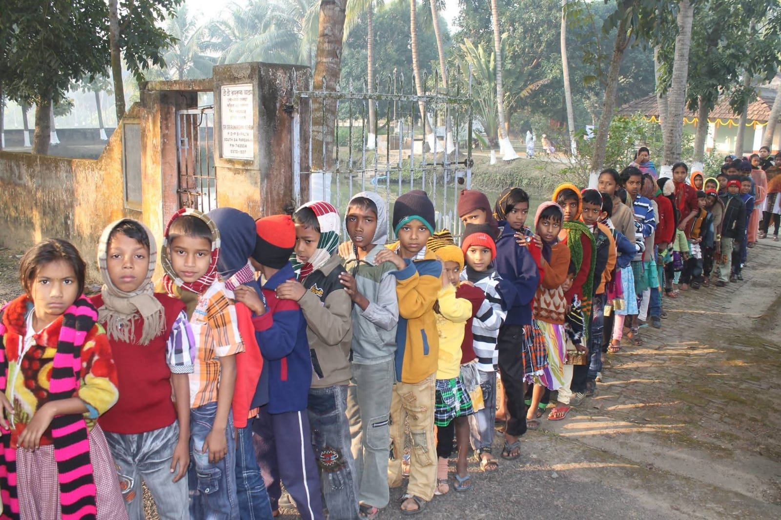 Children lined up for community support