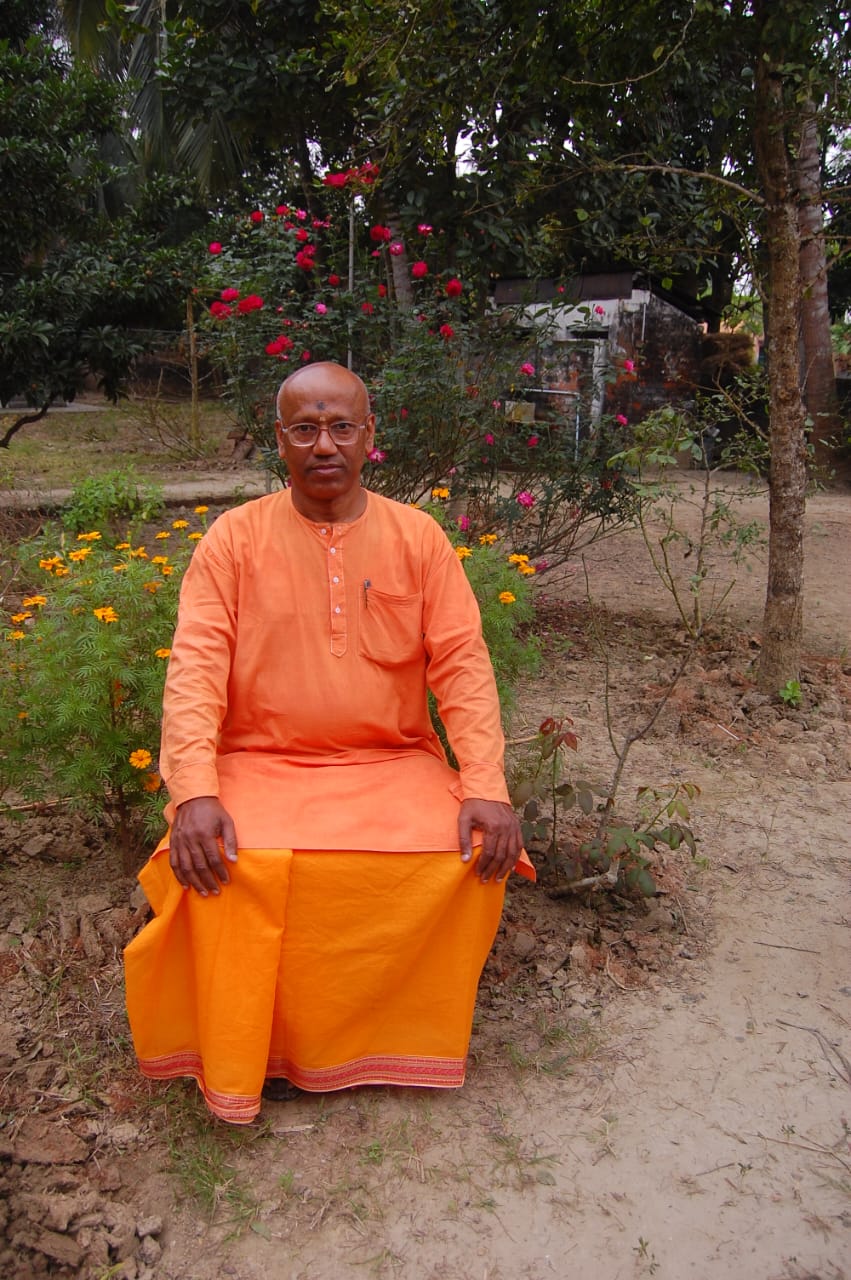 Ashram representative seated on campus